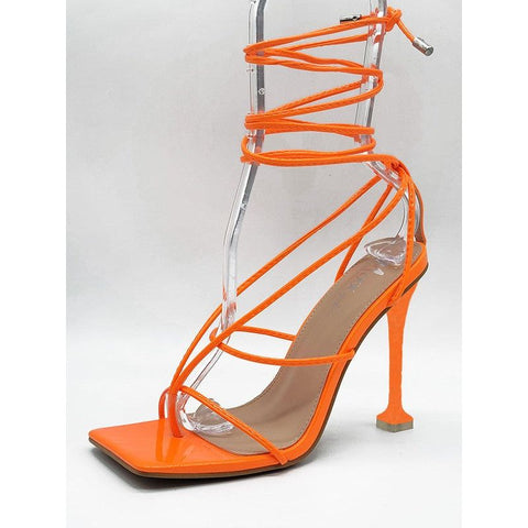 Mixx strappy neon orange heel. 4 inch heel with toe support for a long lasting day or night.